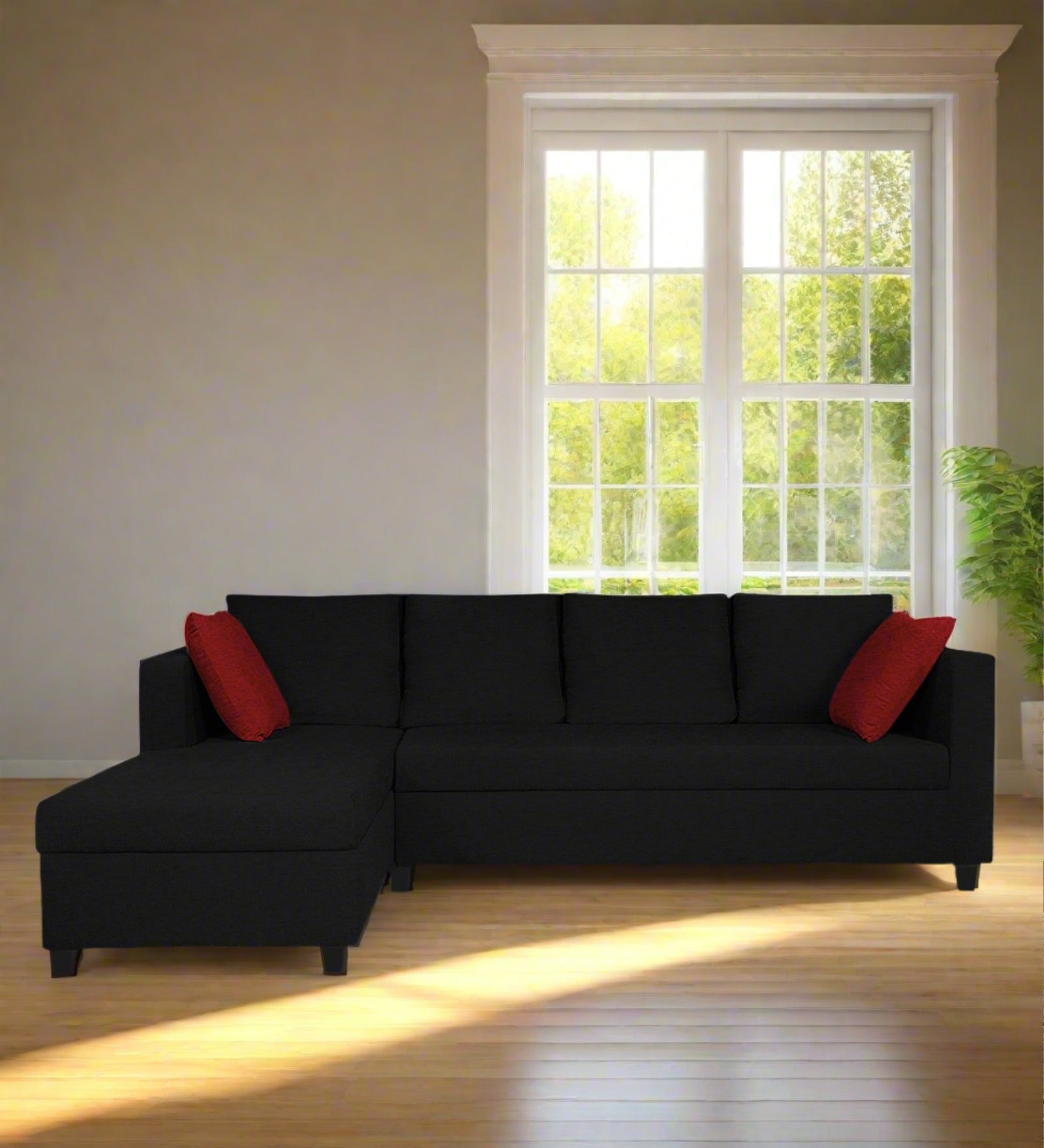 Black couch with red elatic pillows