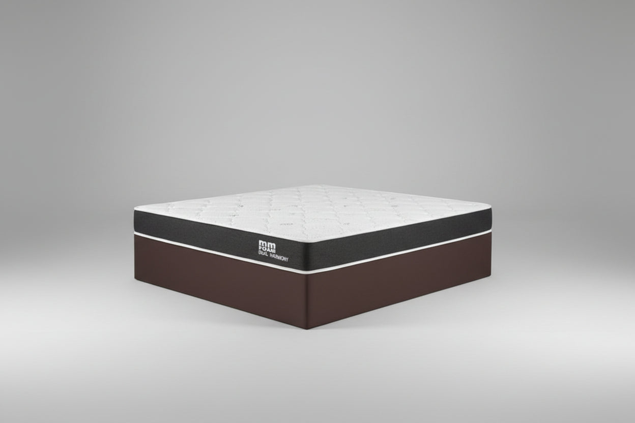 Mattress in a bedroom setting with a plant and lamp