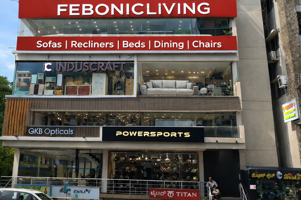 Commercial building with multiple store signs including FebonicLiving,