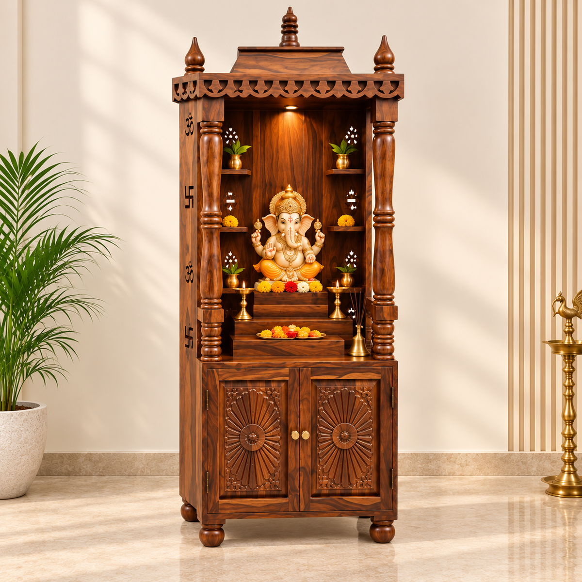 A dark brown carved wooden Shiva mandarin altar with a golden Lord Ganesha statue, displayed in a styled room setting with a potted plant on the left and a brass stand on the right.