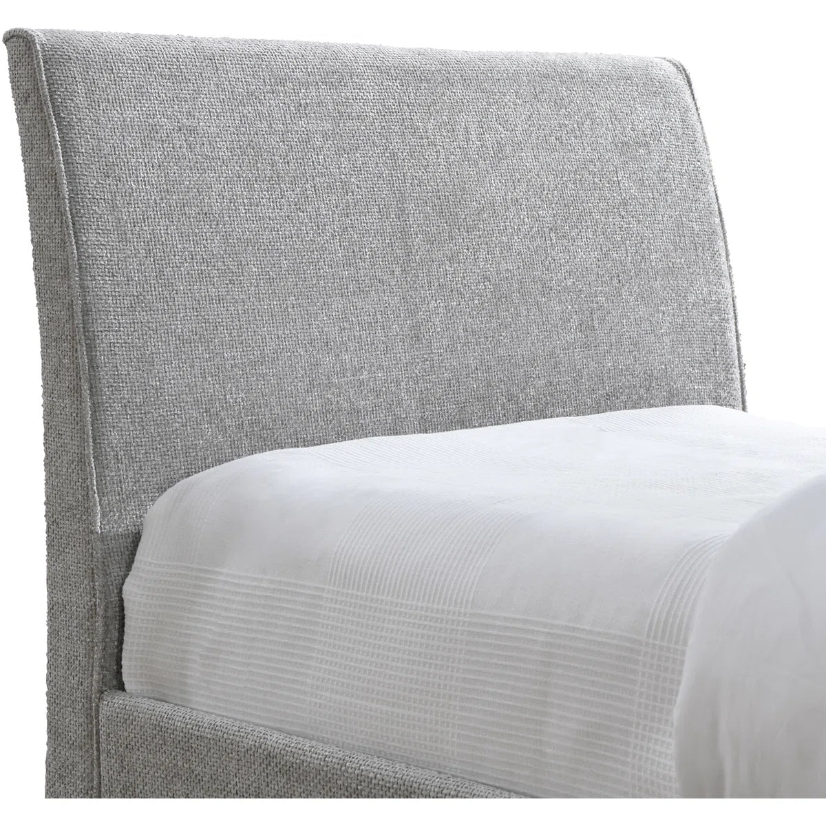 Gray upholstered headboard with white bedding