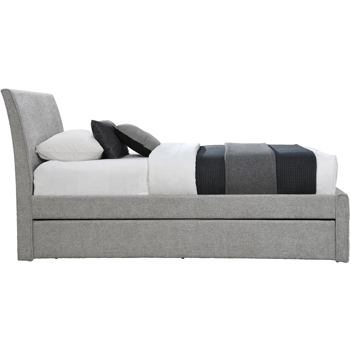 Gray upholstered bed with white bedding and black and gray striped blanket on a white background